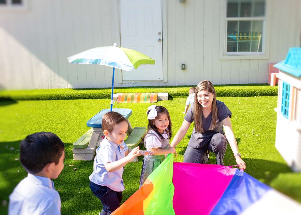 Mrs. Orozco, founder of The Learning Space Academy, with students in the classroom